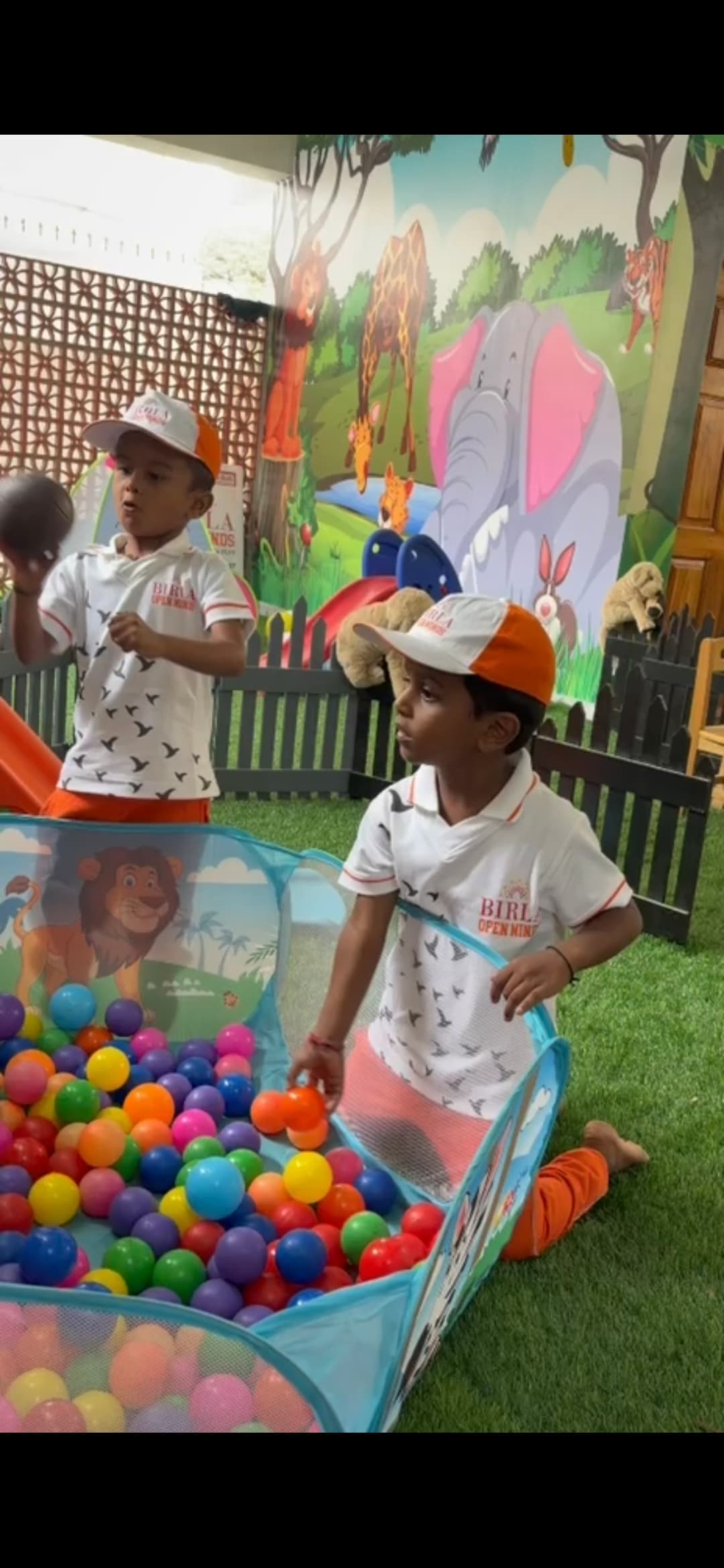 Children playing in the ball pit in the indoor play zone.
