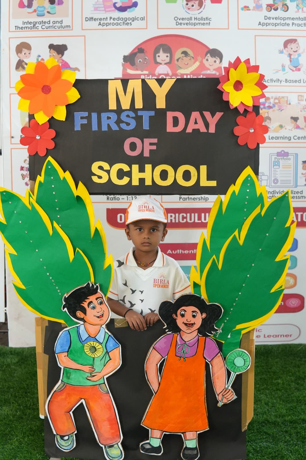 A child at the 'My First Day of School' photo booth at the Khuba Plot campus.